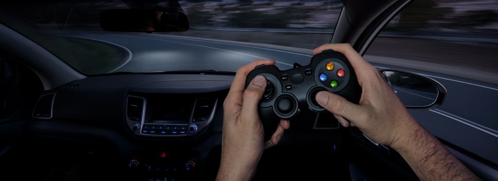 Driver using gaming controller to drive a car