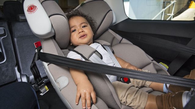 A baby in a forward facing car seat by Kidsafe Queensland