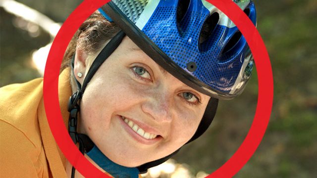 A female bike rider with her face circled red
