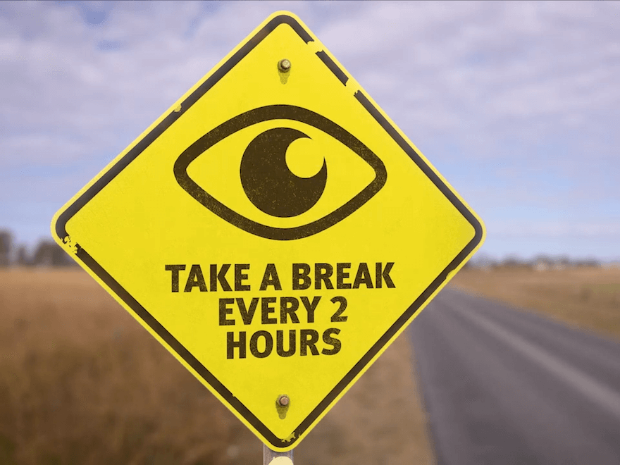 A yellow road sign that says 'Take a break every two hours'