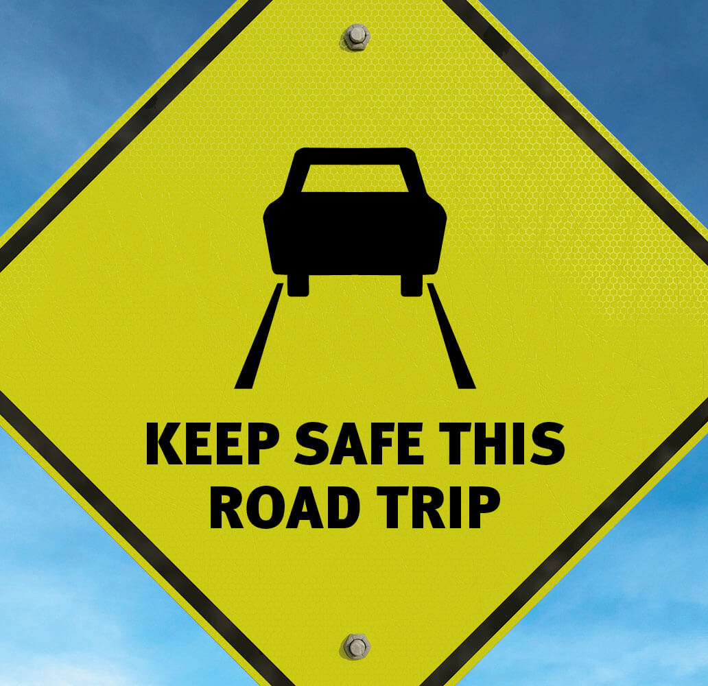 Yellow road sign that says, 'Keep safe this road trip.'